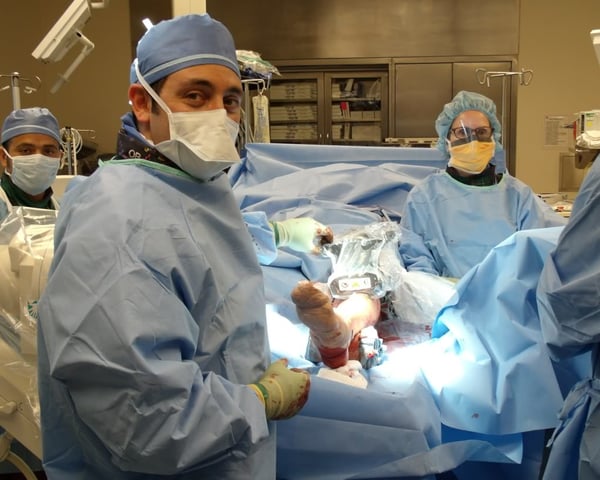 group of surgeons performing height lengthening surgery