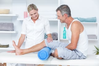 Doctor examining her patient leg in medical office stem cell therapy candidate.jpeg