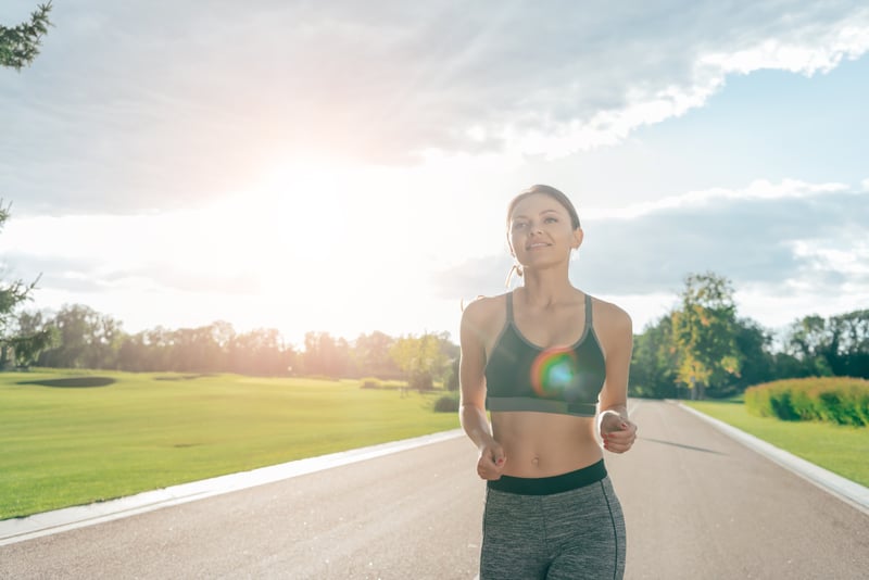 risk of bow legs woman running in park .jpg