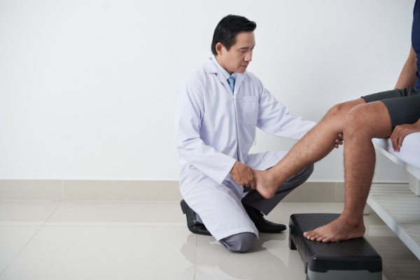 doctor examining legs