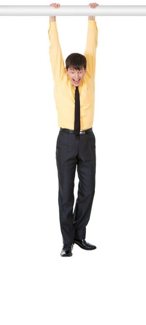man hanging on a bar increasing height exercise